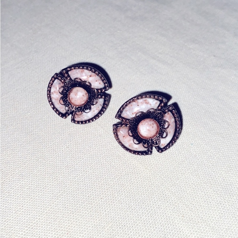 Vintage sparkling stone and ornate metal earrings. Twist on posts.